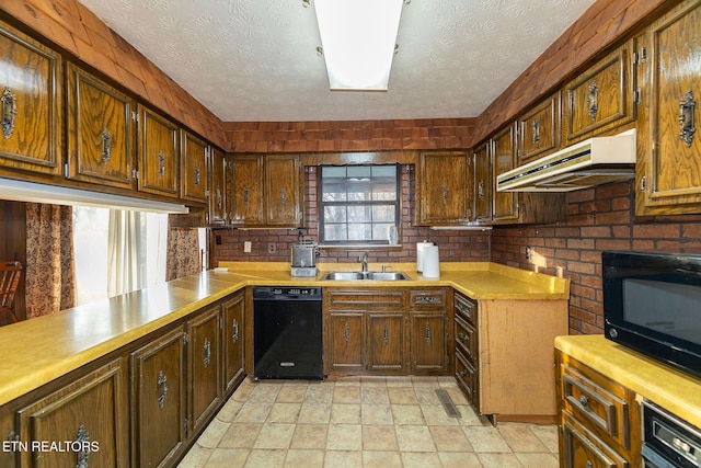 kitchen featuring a textured ceiling, sink, and black appliances