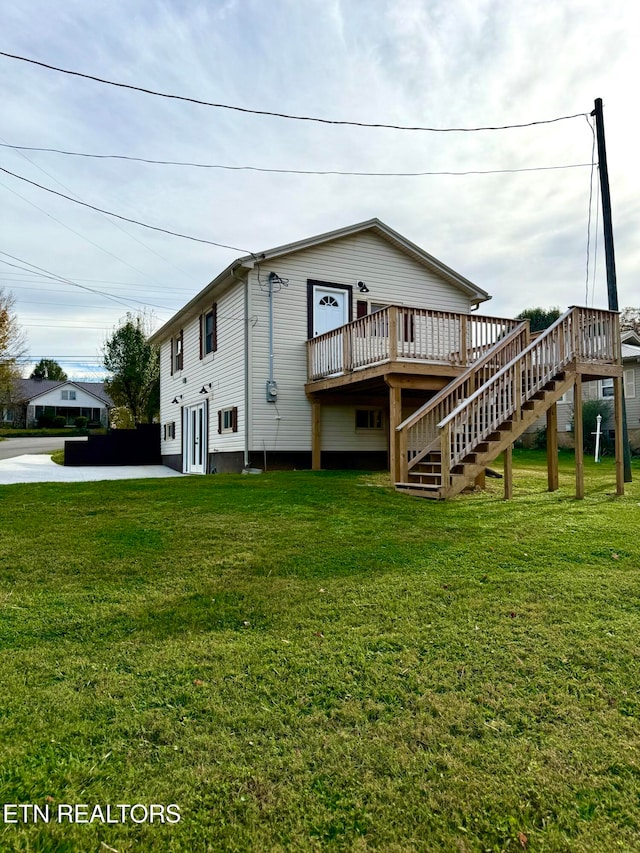 exterior space featuring a deck and a lawn