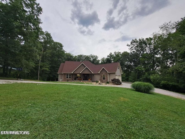 178 Woods Hill Rd, Helenwood, TN 37755 - single story home with a front lawn, curved driveway, and covered porch