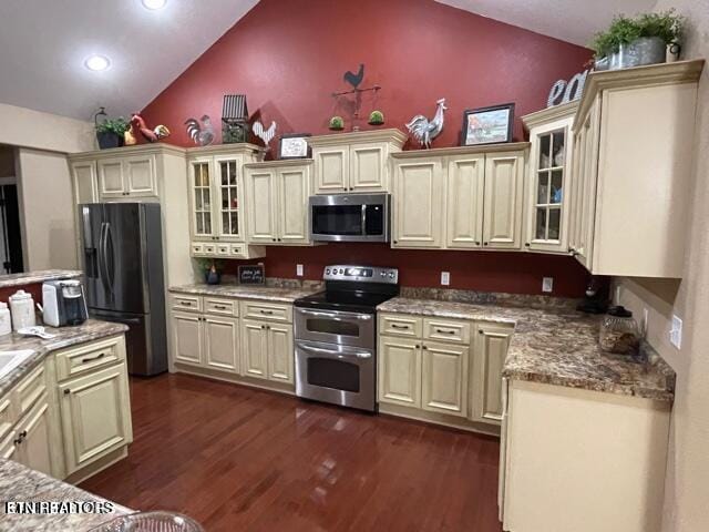 178 Woods Hill Rd, Helenwood, TN 37755 - kitchen with stainless steel appliances, cream cabinetry, dark wood-style flooring, glass insert cabinets, and high vaulted ceiling