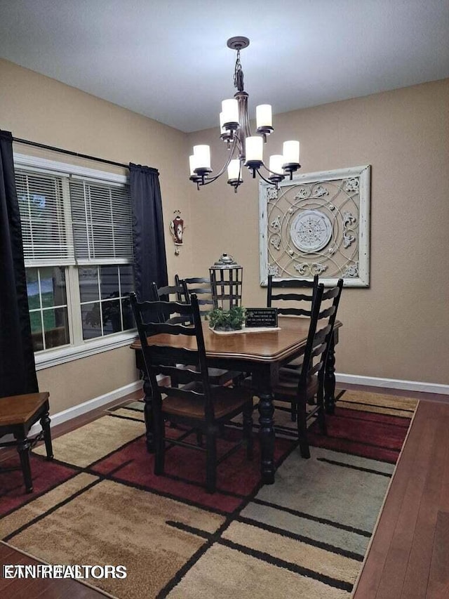 178 Woods Hill Rd, Helenwood, TN 37755 - dining area with a chandelier, baseboards, and wood finished floors