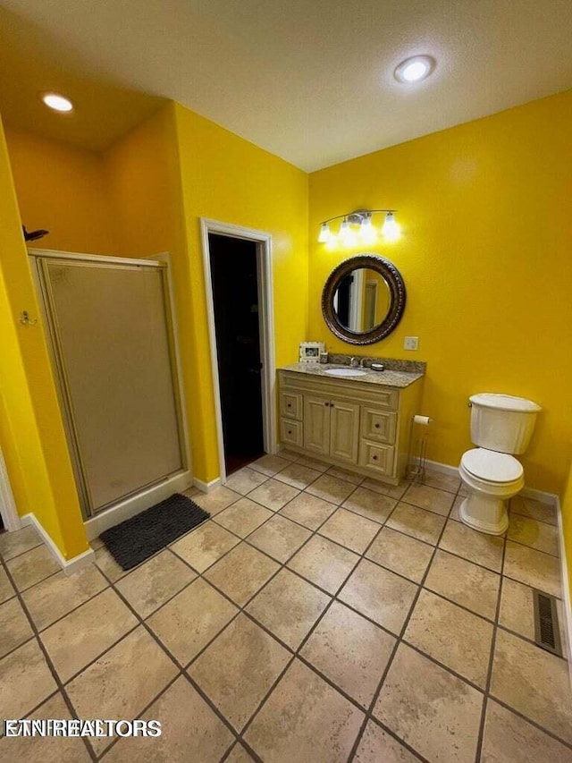 178 Woods Hill Rd, Helenwood, TN 37755 - bathroom featuring a shower stall, tile patterned floors, vanity, baseboards, and toilet