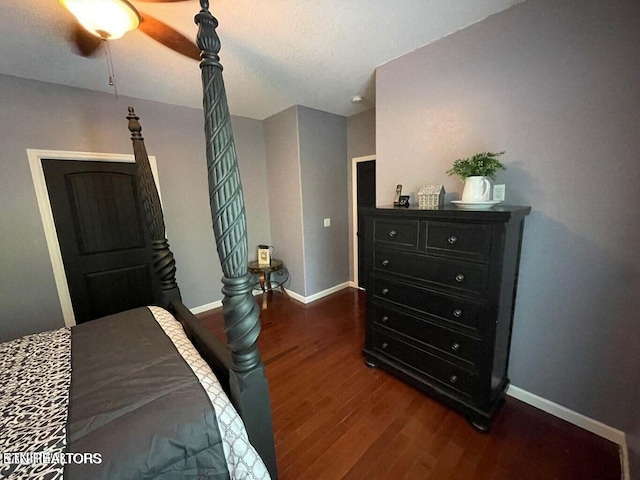 bedroom featuring ceiling fan and dark wood-type flooring