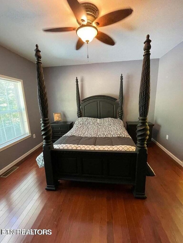 bedroom featuring ceiling fan and dark hardwood / wood-style floors