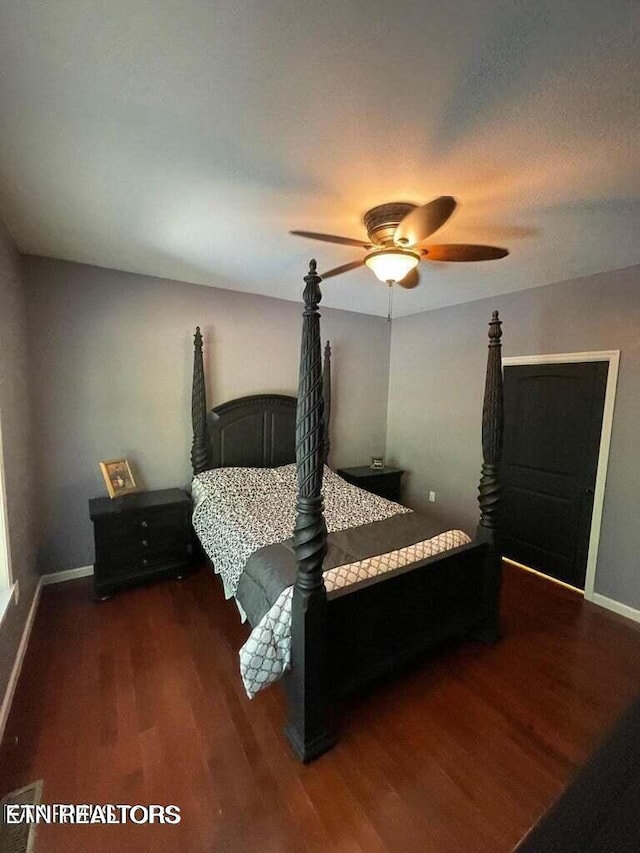 bedroom featuring dark hardwood / wood-style floors and ceiling fan