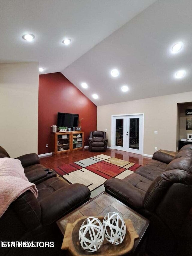 living room featuring french doors and lofted ceiling