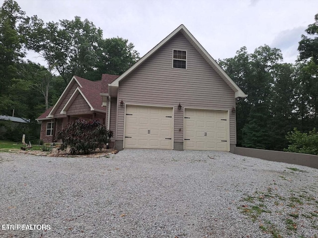 178 Woods Hill Rd, Helenwood, TN 37755 - view of property exterior featuring a garage and driveway