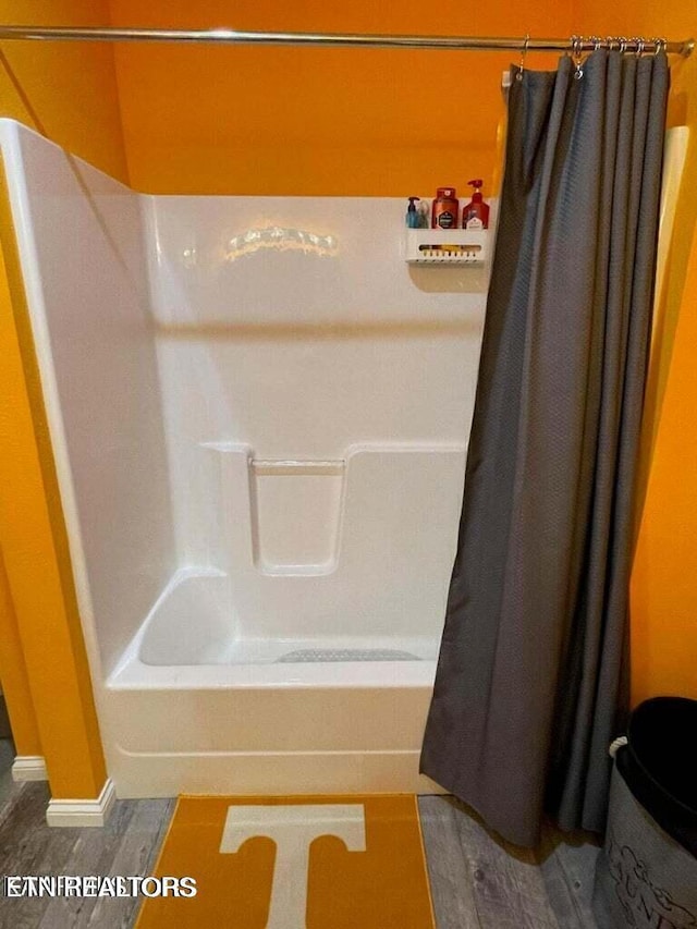 178 Woods Hill Rd, Helenwood, TN 37755 - bathroom with shower / bath combo with shower curtain and baseboards