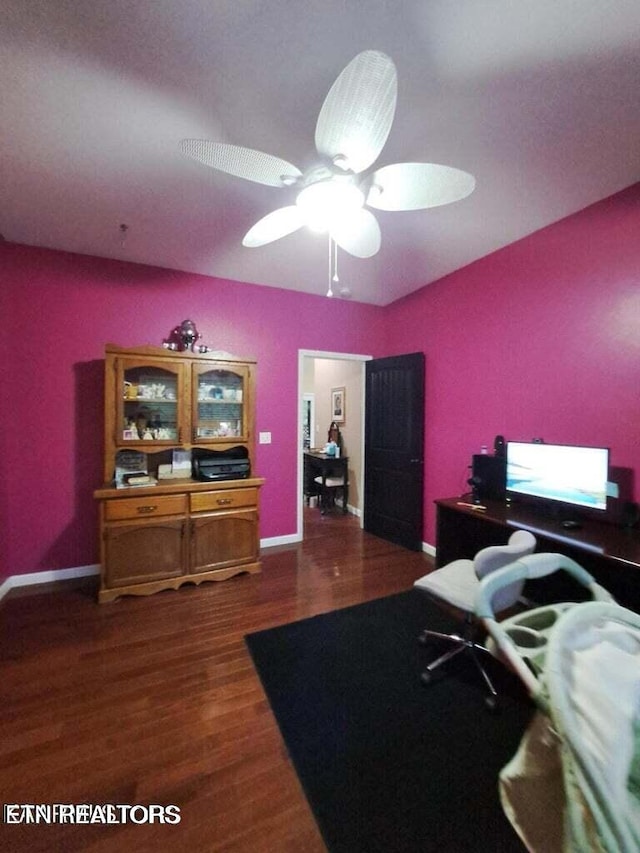 bedroom with ceiling fan and dark hardwood / wood-style flooring