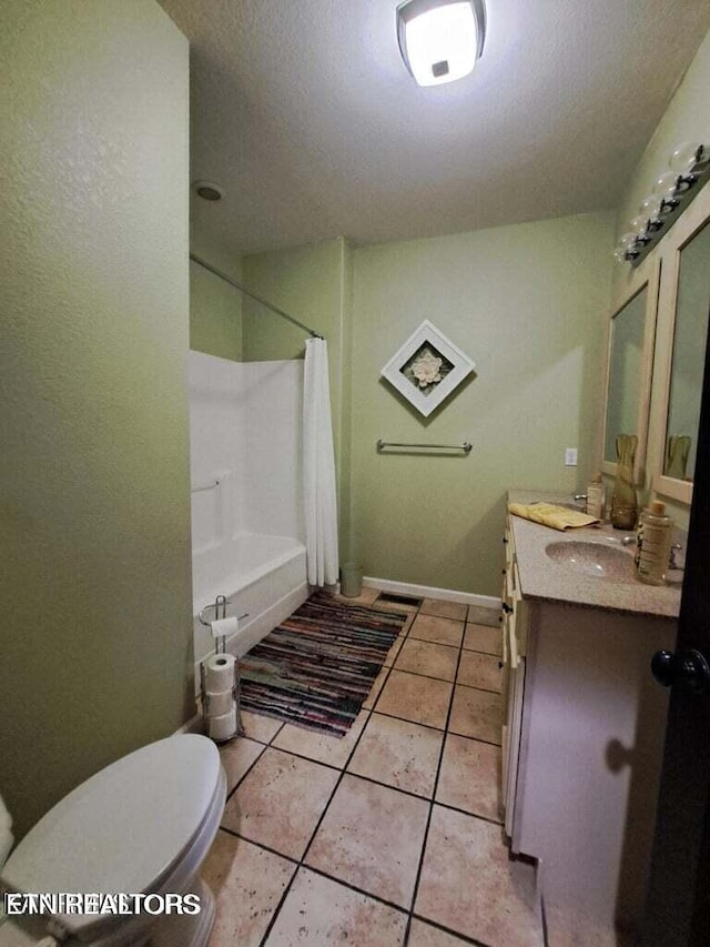 full bathroom with shower / bath combination with curtain, vanity, a textured ceiling, tile patterned flooring, and toilet