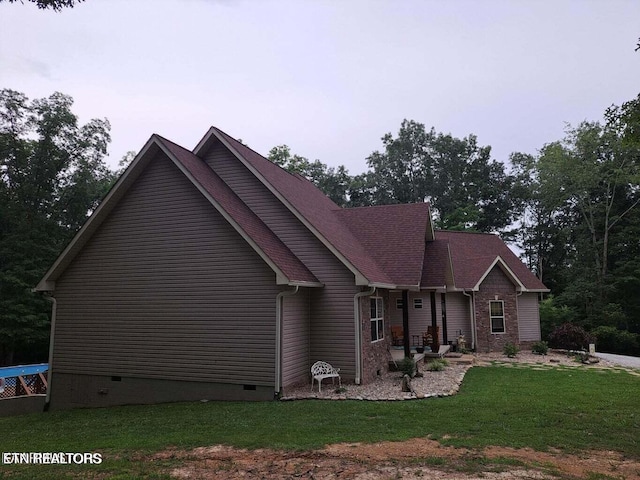 view of property exterior featuring a yard