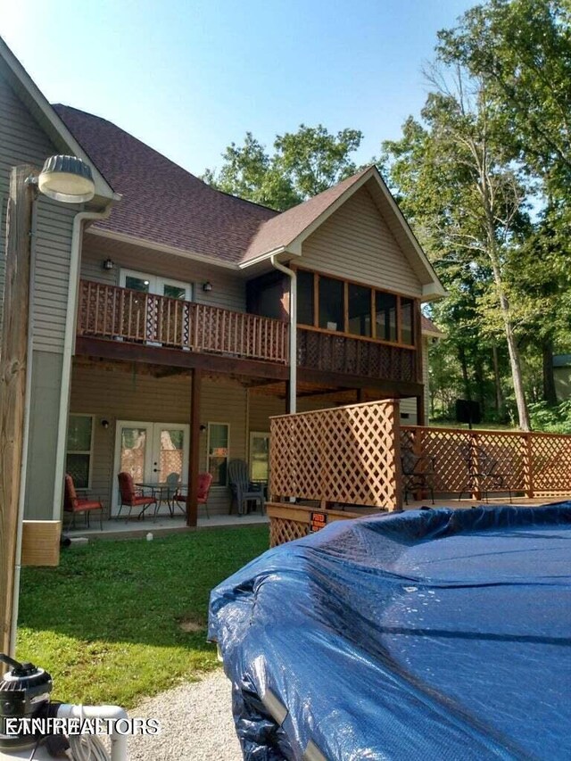 back of house featuring a yard and a patio