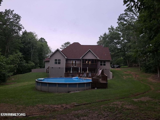 178 Woods Hill Rd, Helenwood, TN 37755 - rear view of property with a yard, an outdoor pool, and a deck