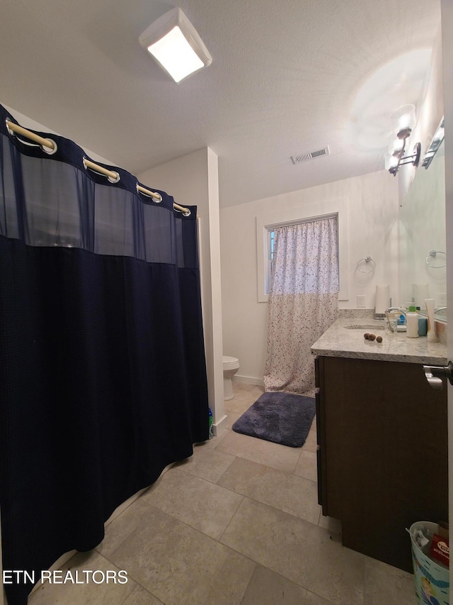 bathroom with tile patterned flooring, visible vents, toilet, a shower with shower curtain, and vanity