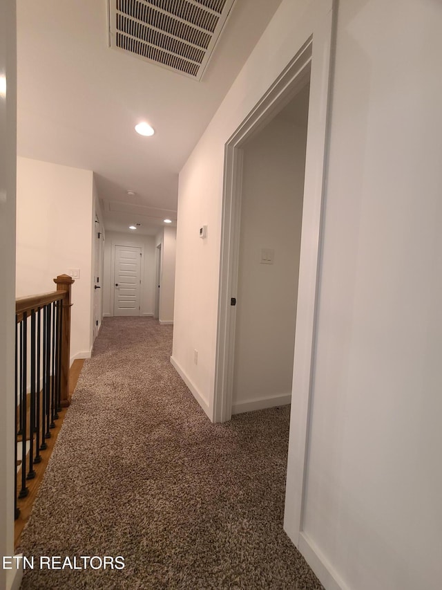 hall with recessed lighting, visible vents, carpet floors, and baseboards