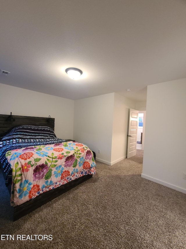 bedroom featuring carpet flooring, visible vents, and baseboards