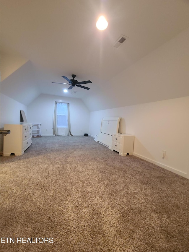 bonus room featuring visible vents, baseboards, carpet, lofted ceiling, and ceiling fan