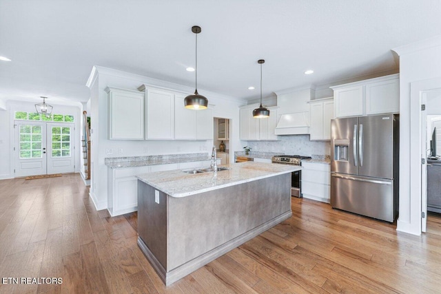 kitchen featuring white cabinetry, appliances with stainless steel finishes, and a sink