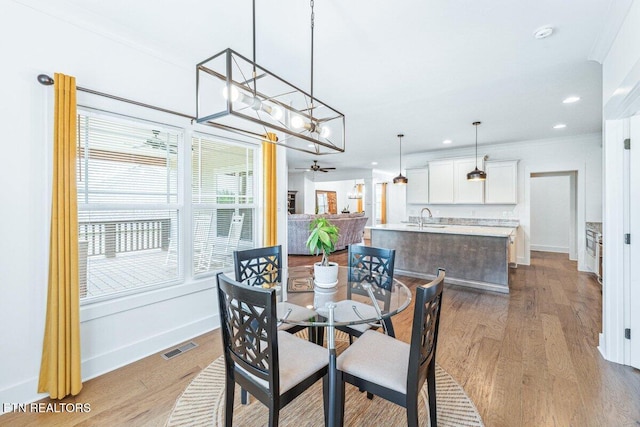 dining space featuring wood finished floors, visible vents, baseboards, ceiling fan, and recessed lighting