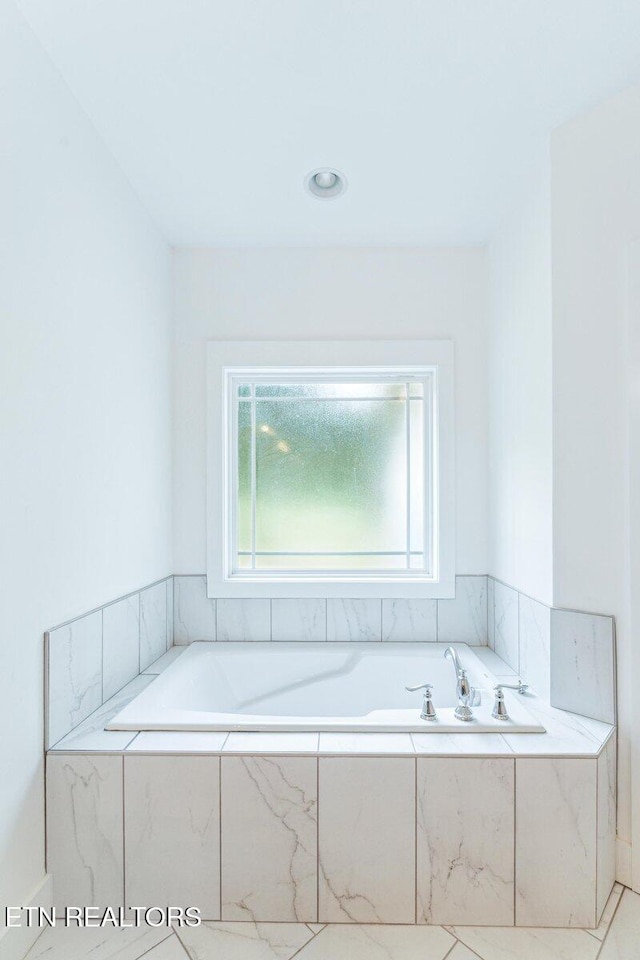 bathroom featuring a garden tub