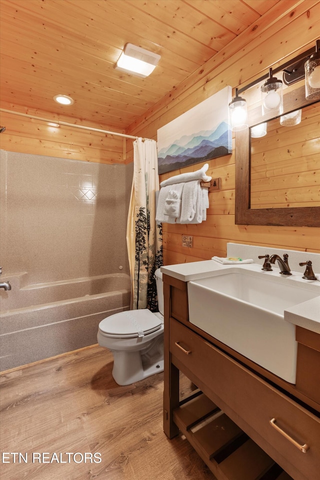 full bathroom with vanity, wood walls, shower / bathtub combination with curtain, wood-type flooring, and wood ceiling