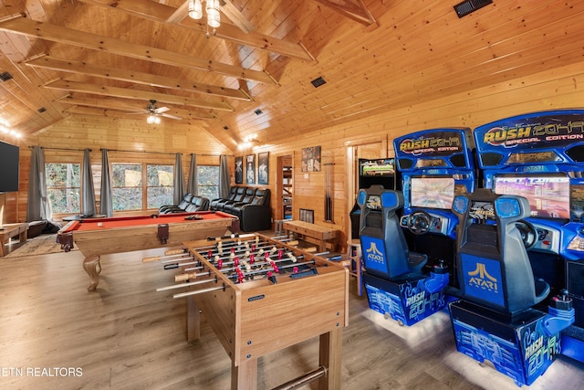 recreation room with lofted ceiling with beams, billiards, wooden walls, ceiling fan, and wood-type flooring