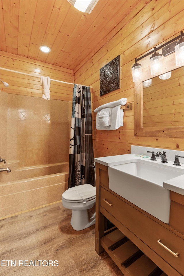 full bathroom featuring wood-type flooring, toilet, shower / bathtub combination with curtain, and wood walls