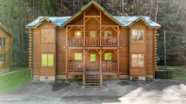 315 Caney Creek Rd, Pigeon Forge, TN 37863 - log home with log exterior, crawl space, a balcony, and a forest view