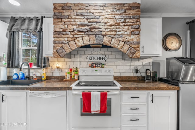 kitchen with white appliances, backsplash, white cabinets, sink, and ornamental molding