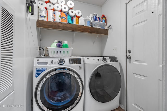 washroom featuring washer and clothes dryer