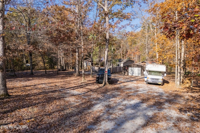 exterior space with a garage and an outdoor structure