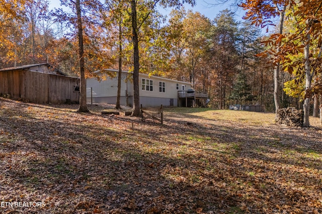 view of yard with a wooden deck