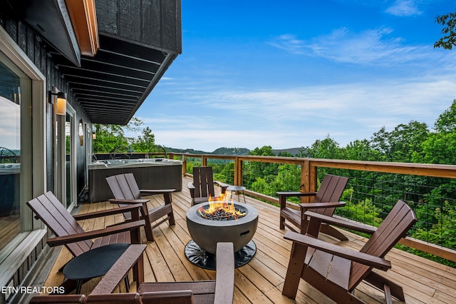 deck featuring an outdoor fire pit