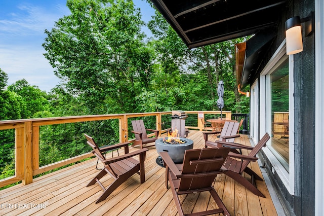 deck with an outdoor fire pit