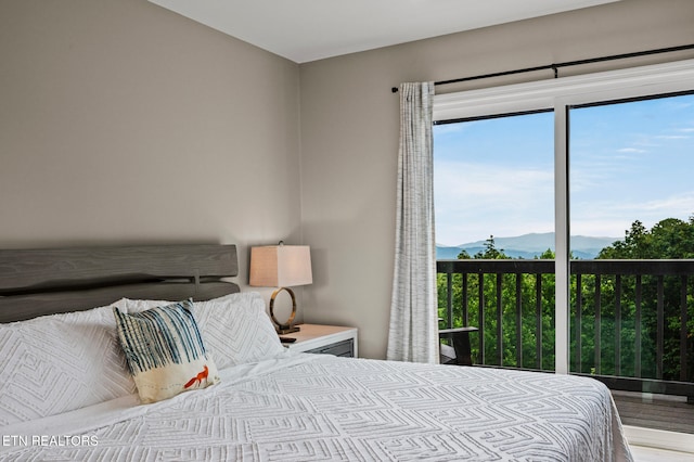 bedroom featuring a mountain view