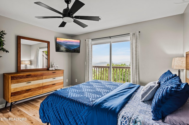 bedroom featuring access to outside, ceiling fan, and wood-type flooring