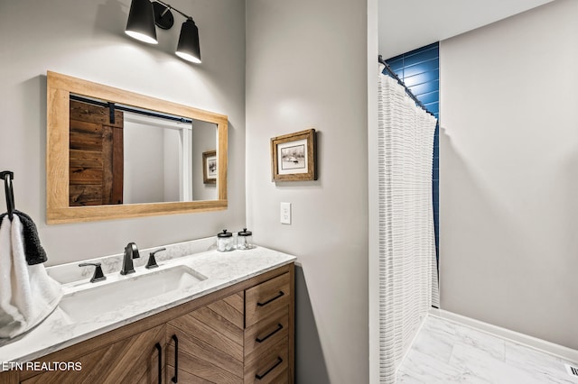 bathroom with a shower with curtain and vanity