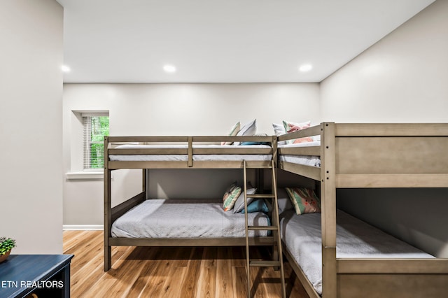 bedroom with hardwood / wood-style floors