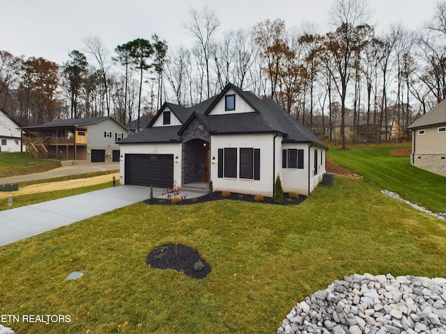 french country inspired facade with a garage and a front lawn