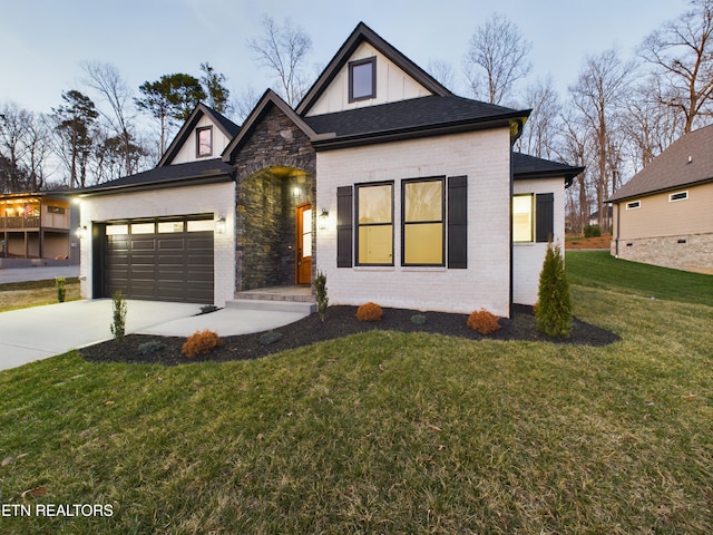 view of front of property with board and batten siding, a front yard, concrete driveway, and brick siding