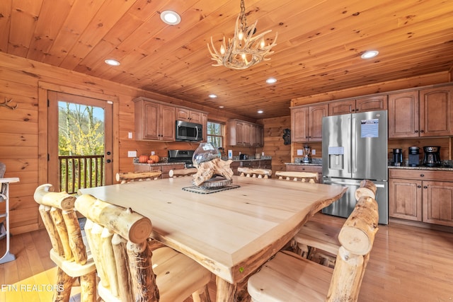 dining area featuring wooden walls, wood ceiling, and light wood-type flooring