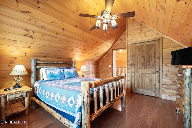 bedroom featuring wooden walls, hardwood / wood-style floors, wood ceiling, and vaulted ceiling