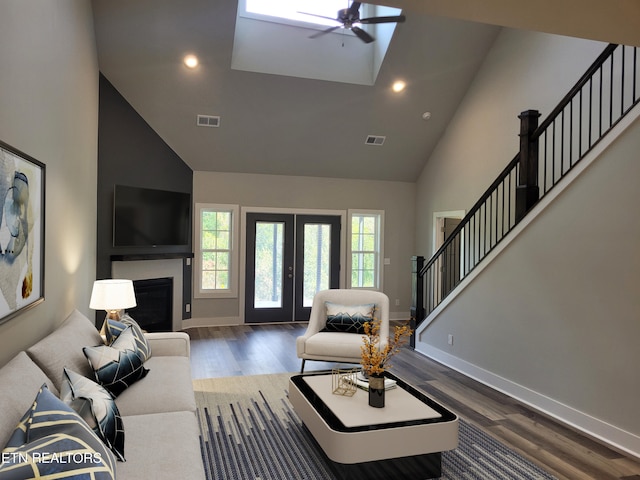 living room with ceiling fan, dark wood-type flooring, high vaulted ceiling, and french doors