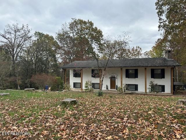 bi-level home with a front yard