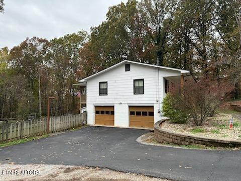 view of side of property with a garage