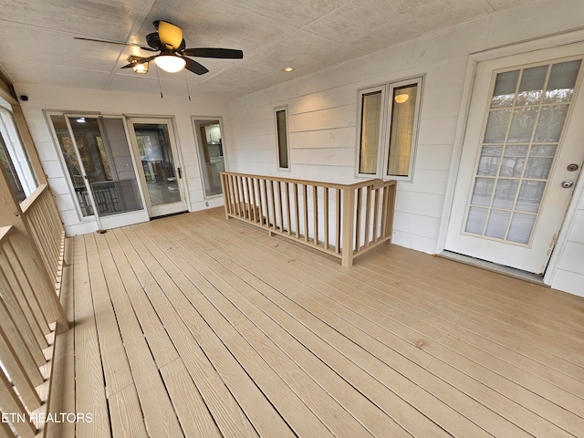 wooden deck featuring ceiling fan