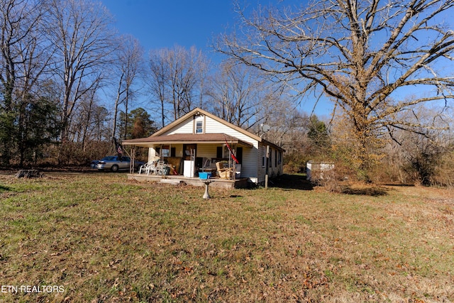 exterior space with a porch and a yard