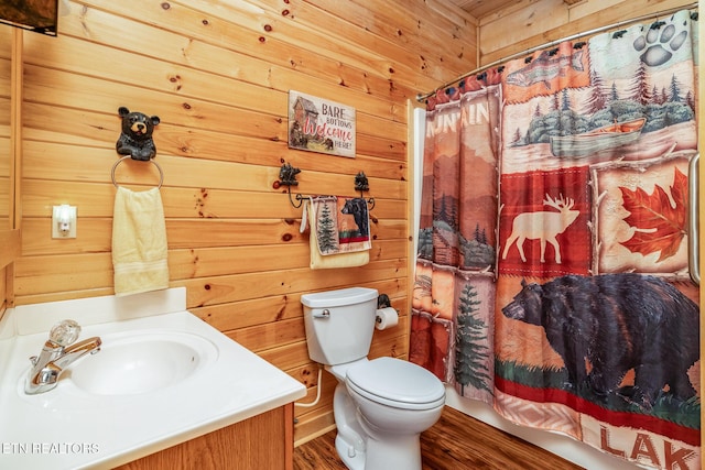 1006 Gordon Way, Sevierville, TN 37876 - bathroom featuring toilet, vanity, wood walls, curtained shower, and wood finished floors