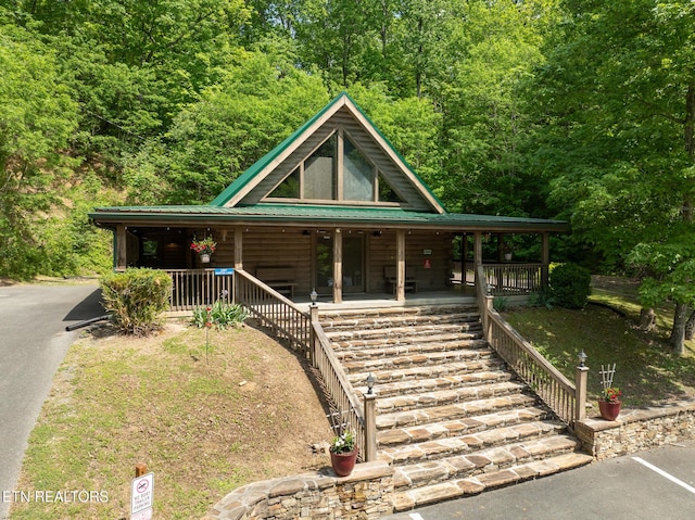 1006 Gordon Way, Sevierville, TN 37876 - view of front of home with covered porch, metal roof, and stairway