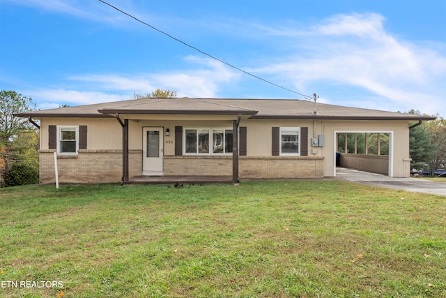 ranch-style house featuring a front yard and a carport